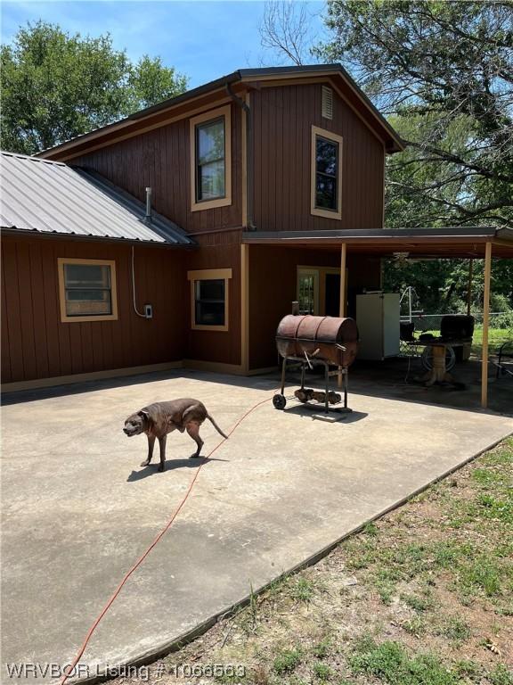 rear view of property featuring a patio