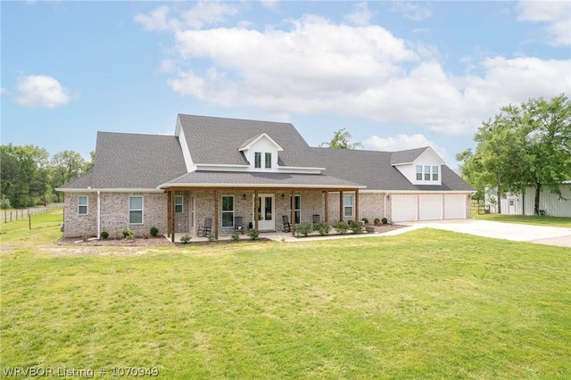 cape cod house featuring a front lawn, a porch, and a garage