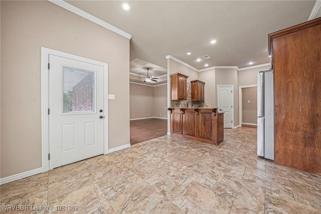 937 Forrest Park Way, Greenwood, AR 72936 - kitchen featuring freestanding refrigerator, ornamental molding, recessed lighting, baseboards, and brown cabinets