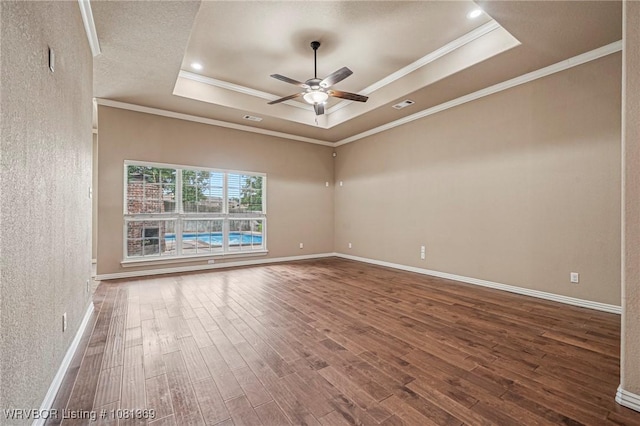937 Forrest Park Way, Greenwood, AR 72936 - empty room with a tray ceiling, wood finished floors, ceiling fan, ornamental molding, and baseboards