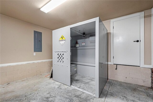 937 Forrest Park Way, Greenwood, AR 72936 - miscellaneous room with electric panel, unfinished concrete floors, concrete block wall, and a textured ceiling