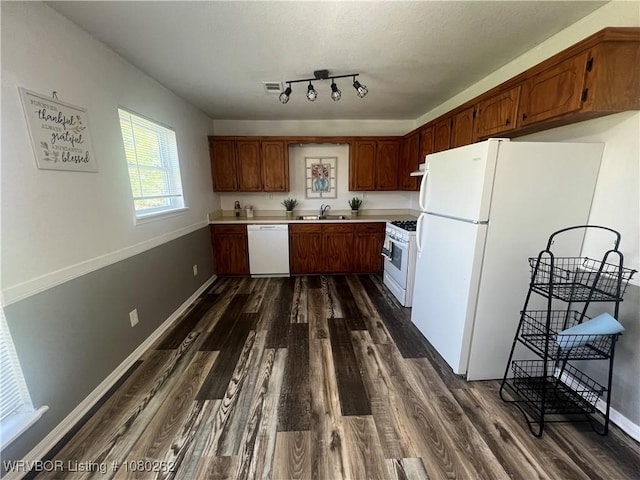 306 Dogwood, Pocola, OK 74902 - kitchen with visible vents, a sink, light countertops, white appliances, and dark wood-style floors