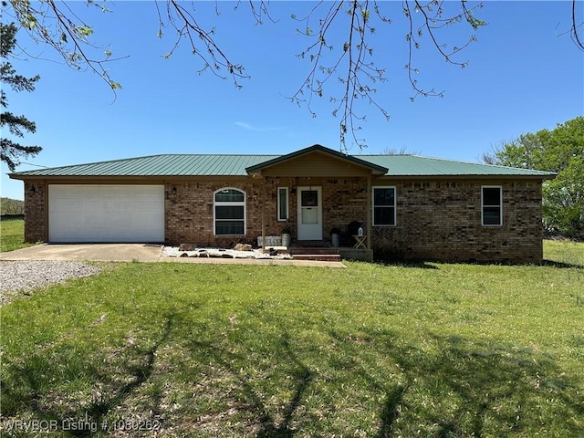 306 Dogwood, Pocola, OK 74902 - ranch-style home featuring metal roof, a garage, brick siding, a front lawn, and driveway