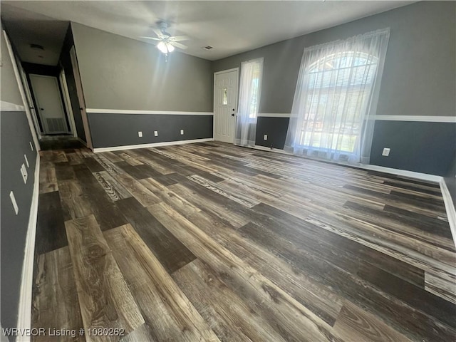 306 Dogwood, Pocola, OK 74902 - unfurnished living room featuring wood finished floors, ceiling fan, baseboards, and visible vents