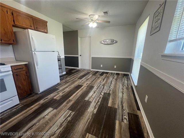 306 Dogwood, Pocola, OK 74902 - kitchen featuring white appliances, dark wood-style floors, visible vents, brown cabinetry, and ceiling fan