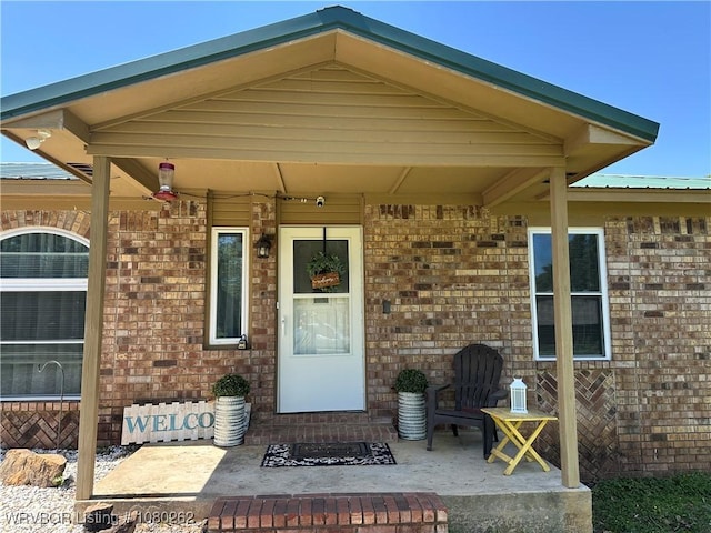306 Dogwood, Pocola, OK 74902 - doorway to property featuring brick siding