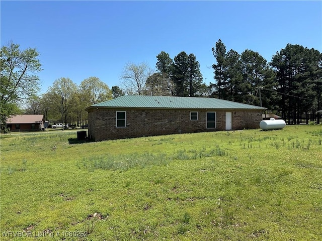 306 Dogwood, Pocola, OK 74902 - view of home's exterior featuring metal roof and a lawn