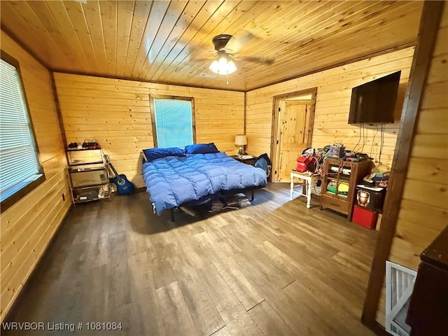 12878 128th St, Gore, OK 74435 - bedroom with wooden walls, wood finished floors, and wood ceiling