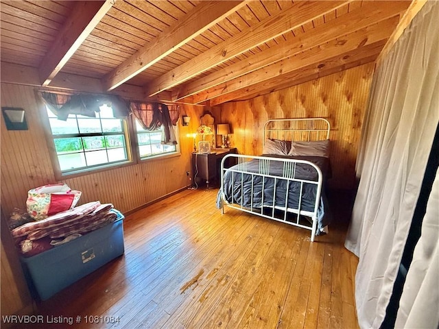 12878 128th St, Gore, OK 74435 - bedroom featuring hardwood / wood-style floors, wooden walls, and wooden ceiling with exposed beams