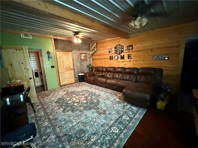 12878 128th St, Gore, OK 74435 - living room with a ceiling fan, wood walls, and wood finished floors