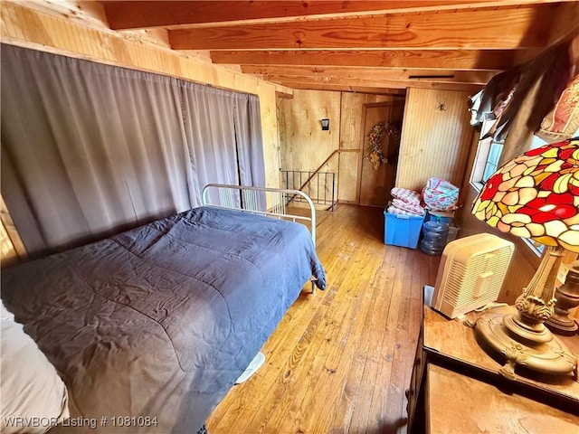 12878 128th St, Gore, OK 74435 - bedroom featuring hardwood / wood-style flooring, beam ceiling, and wood walls