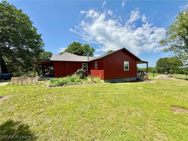 12878 128th St, Gore, OK 74435 - view of side of home featuring a yard and board and batten siding