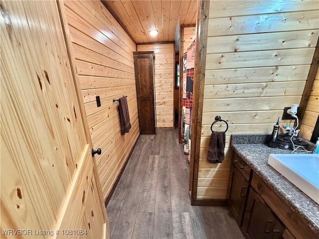 12878 128th St, Gore, OK 74435 - bathroom featuring wood walls, wood finished floors, wooden ceiling, and vanity