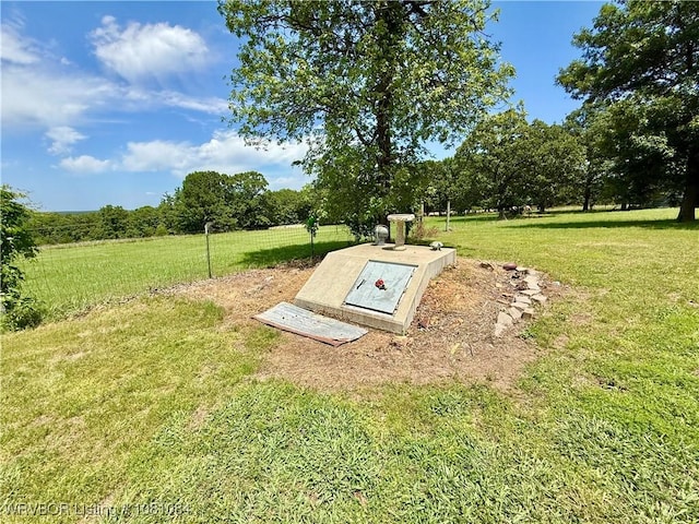12878 128th St, Gore, OK 74435 - view of storm shelter featuring a yard