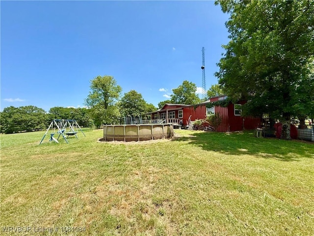 12878 128th St, Gore, OK 74435 - view of green lawn featuring an outdoor pool