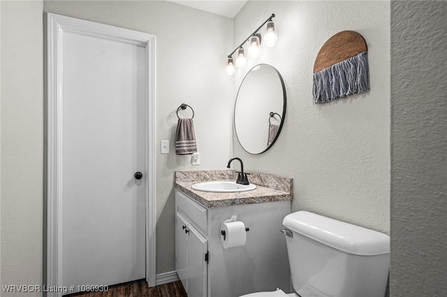 1003 Blair St, Pocola, OK 74902 - half bath with toilet, vanity, and wood finished floors