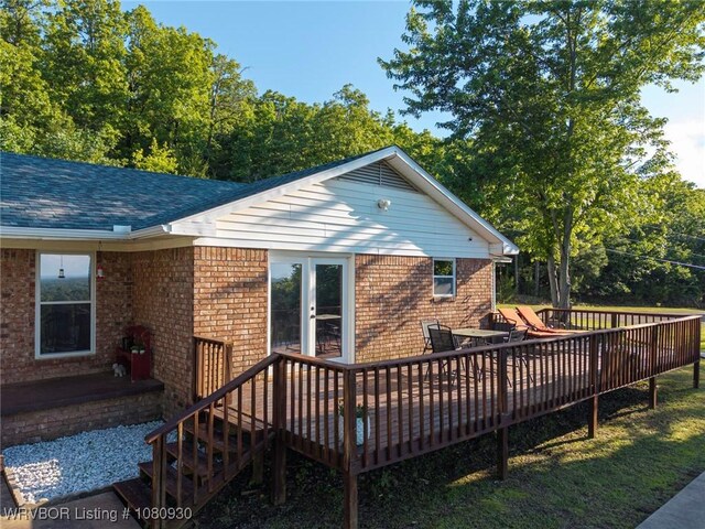 1003 Blair St, Pocola, OK 74902 - rear view of house with a deck, brick siding, and roof with shingles