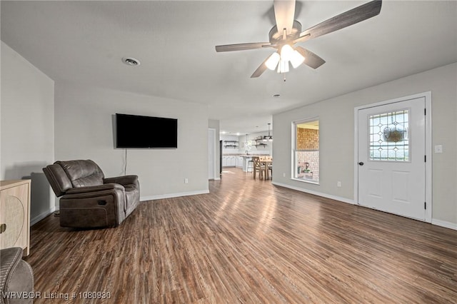 1003 Blair St, Pocola, OK 74902 - unfurnished living room featuring wood finished floors, ceiling fan, and baseboards
