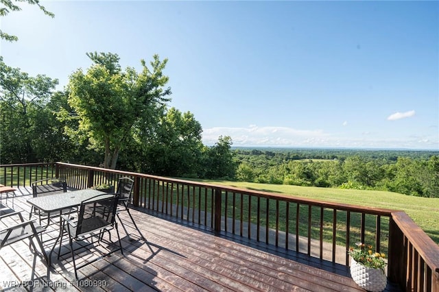 1003 Blair St, Pocola, OK 74902 - wooden deck featuring outdoor dining space, a yard, and a forest view