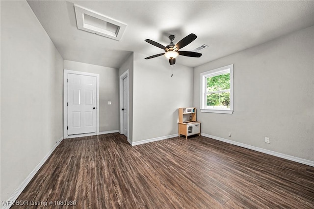 1003 Blair St, Pocola, OK 74902 - unfurnished room featuring attic access, dark wood-style floors, baseboards, and a ceiling fan