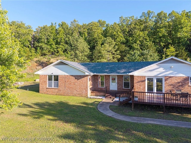 1003 Blair St, Pocola, OK 74902 - view of front of home featuring french doors, a front yard, a wooden deck, brick siding, and a shingled roof