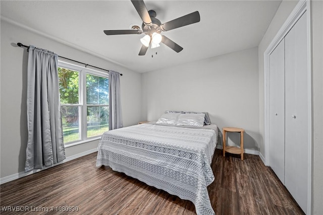 1003 Blair St, Pocola, OK 74902 - bedroom featuring baseboards, wood finished floors, a closet, and a ceiling fan