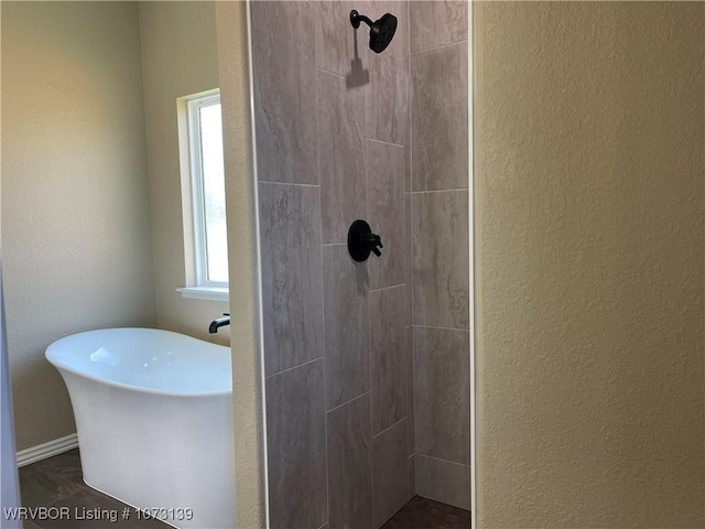 bathroom with a shower and hardwood / wood-style flooring