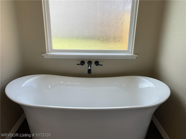 bathroom featuring a tub