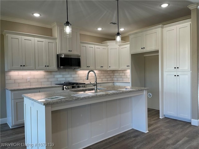 kitchen featuring white cabinetry and decorative light fixtures