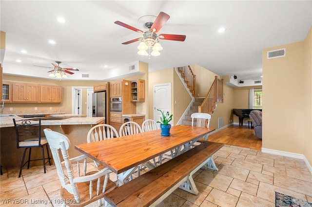 1760 N Ulmer St, Greenwood, AR 72936 - dining room with ceiling fan, stone tile flooring, stairway, baseboards, and recessed lighting