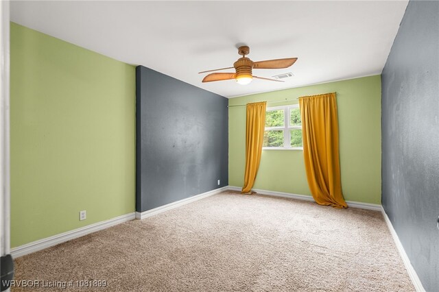 1760 N Ulmer St, Greenwood, AR 72936 - carpeted spare room with ceiling fan and baseboards