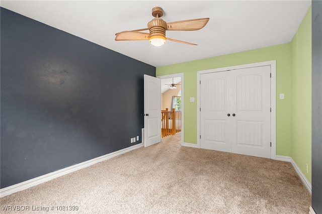 1760 N Ulmer St, Greenwood, AR 72936 - unfurnished bedroom featuring carpet floors, a closet, baseboards, and a ceiling fan