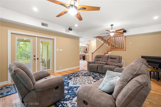 1760 N Ulmer St, Greenwood, AR 72936 - living room featuring ceiling fan, stairs, light wood-style flooring, french doors, and baseboards