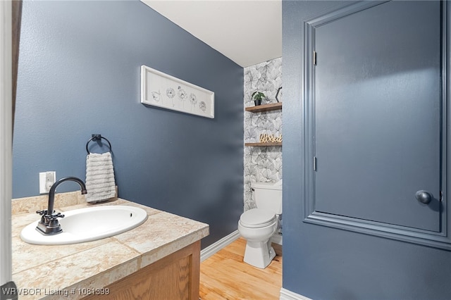 1760 N Ulmer St, Greenwood, AR 72936 - bathroom with toilet, wood finished floors, vanity, and baseboards