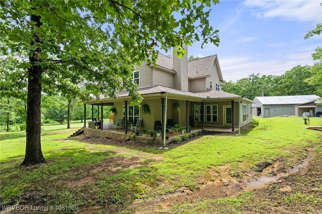 1760 N Ulmer St, Greenwood, AR 72936 - back of property featuring a yard, a patio area, a chimney, and roof with shingles