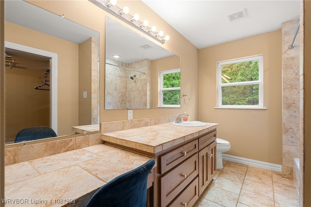 1760 N Ulmer St, Greenwood, AR 72936 - full bathroom with vanity, tiled shower, baseboards, toilet, and a spacious closet