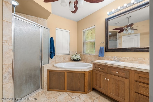 1760 N Ulmer St, Greenwood, AR 72936 - bathroom featuring a ceiling fan, a shower stall, vanity, and a garden tub