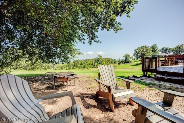 exterior space with a patio, an outdoor fire pit, and a wooden deck