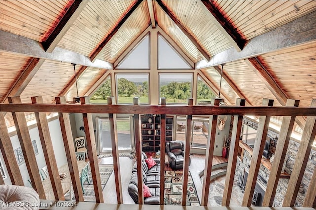 interior space with lofted ceiling with beams and wood ceiling