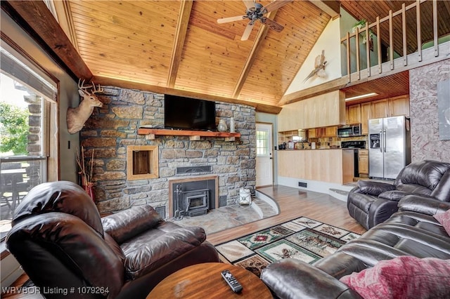 living room with high vaulted ceiling, beam ceiling, wood finished floors, and wood ceiling