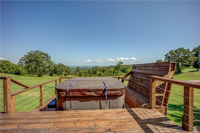 wooden deck featuring a hot tub