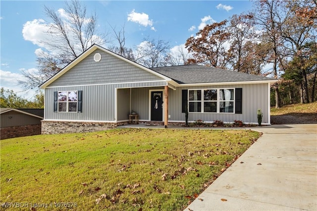 1105 N 21st St, Van Buren, AR 72956 - view of front of property featuring a front lawn, covered porch, and a shingled roof