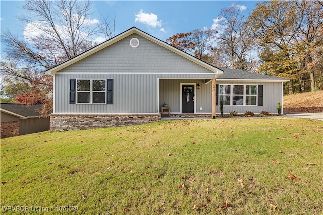 ranch-style house with a front lawn