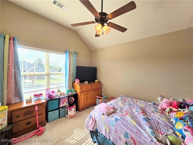 carpeted bedroom featuring ceiling fan and vaulted ceiling