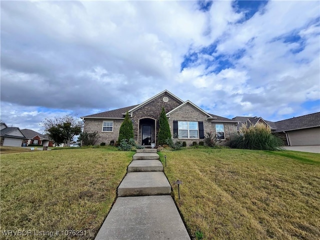 single story home with a front lawn