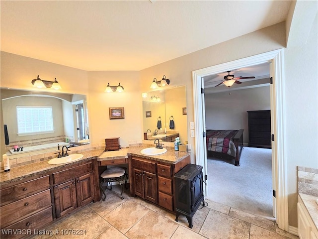 bathroom featuring tile patterned flooring, vanity, and ceiling fan