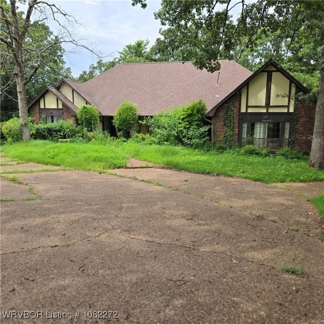 10704 Castleton St, Fort Smith, AR 72908 - tudor-style house featuring brick siding