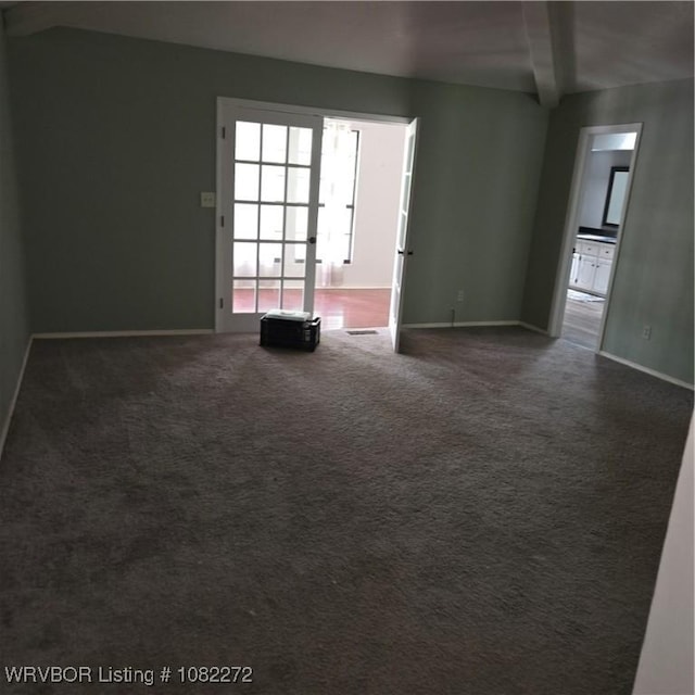 10704 Castleton St, Fort Smith, AR 72908 - empty room featuring beam ceiling and dark carpet