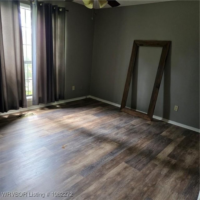 10704 Castleton St, Fort Smith, AR 72908 - unfurnished room featuring healthy amount of natural light, wood finished floors, and a ceiling fan