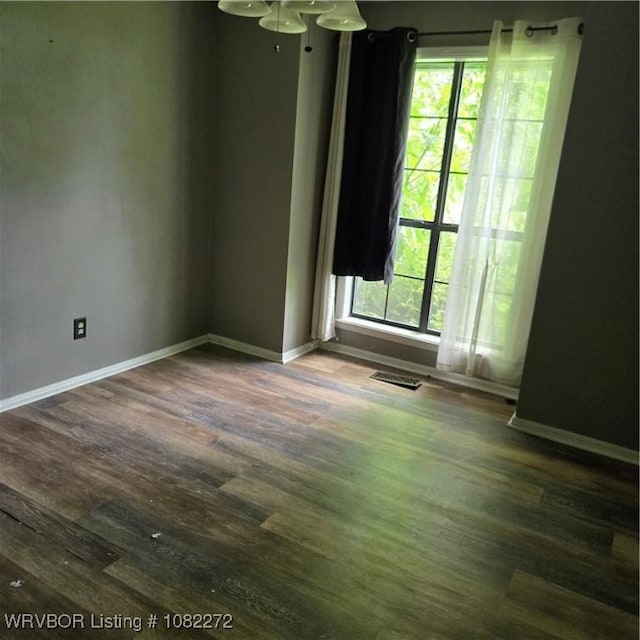 10704 Castleton St, Fort Smith, AR 72908 - unfurnished room with plenty of natural light and wood finished floors